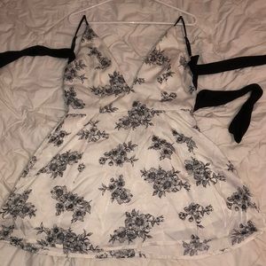 Black and white floral tie back mini dress.